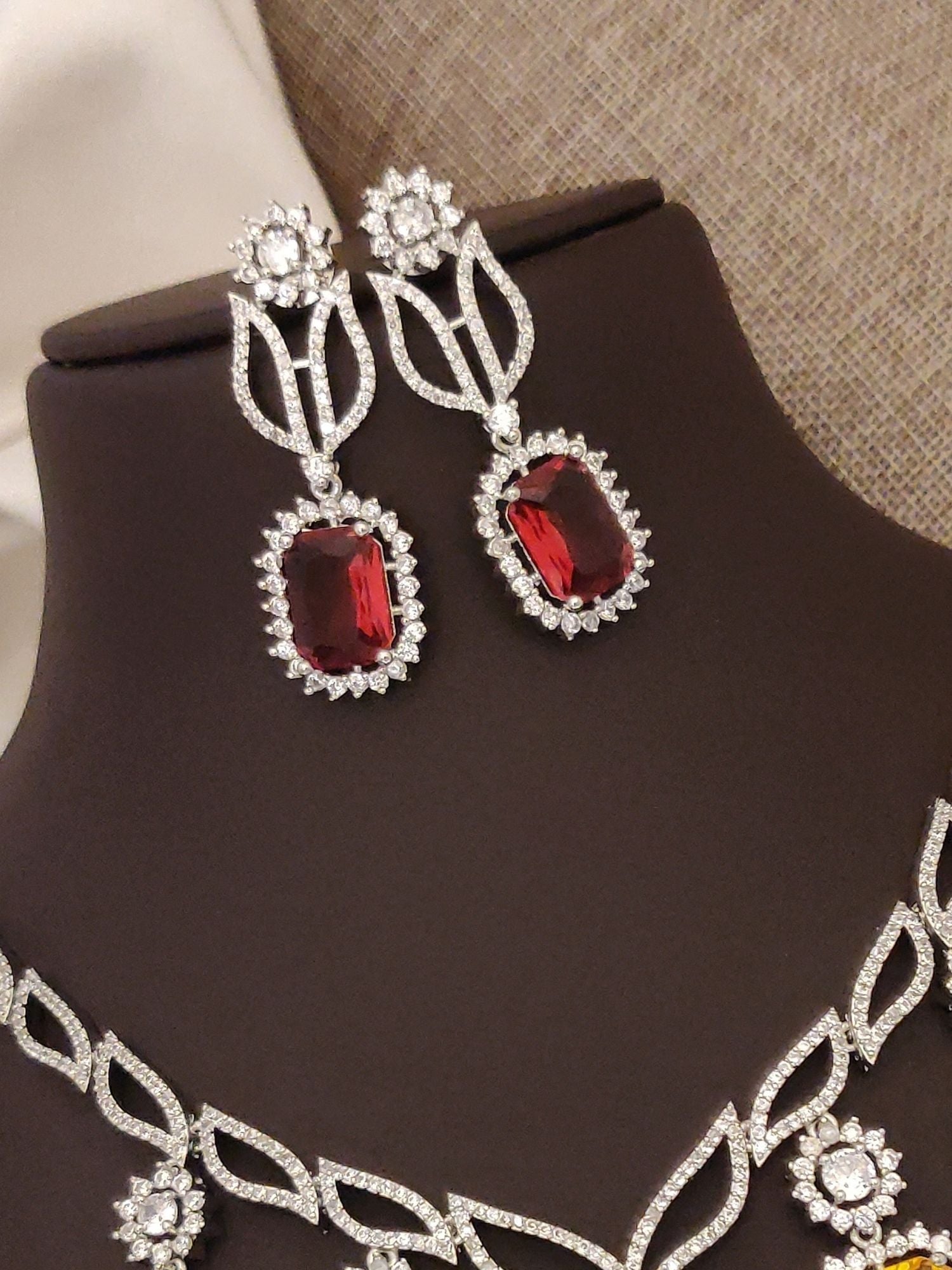 Elegant silver plated american diamond necklace set with red stone earrings for special occasions