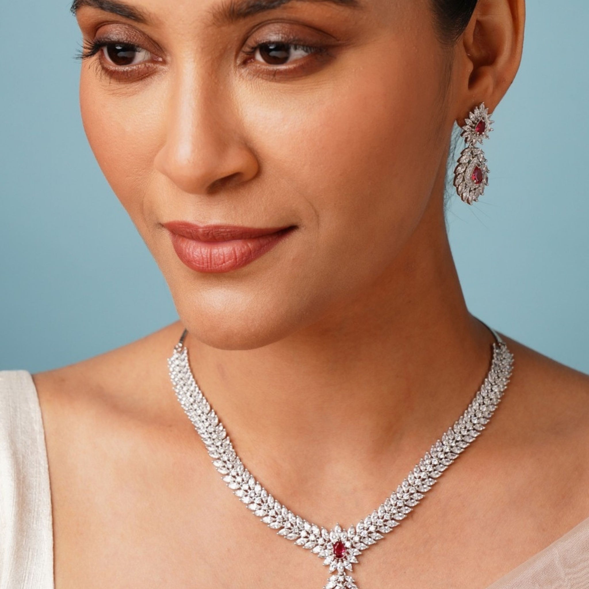 Silver Plated American Diamond Necklace Set with red accents worn by woman by Abdesignsjewellery
