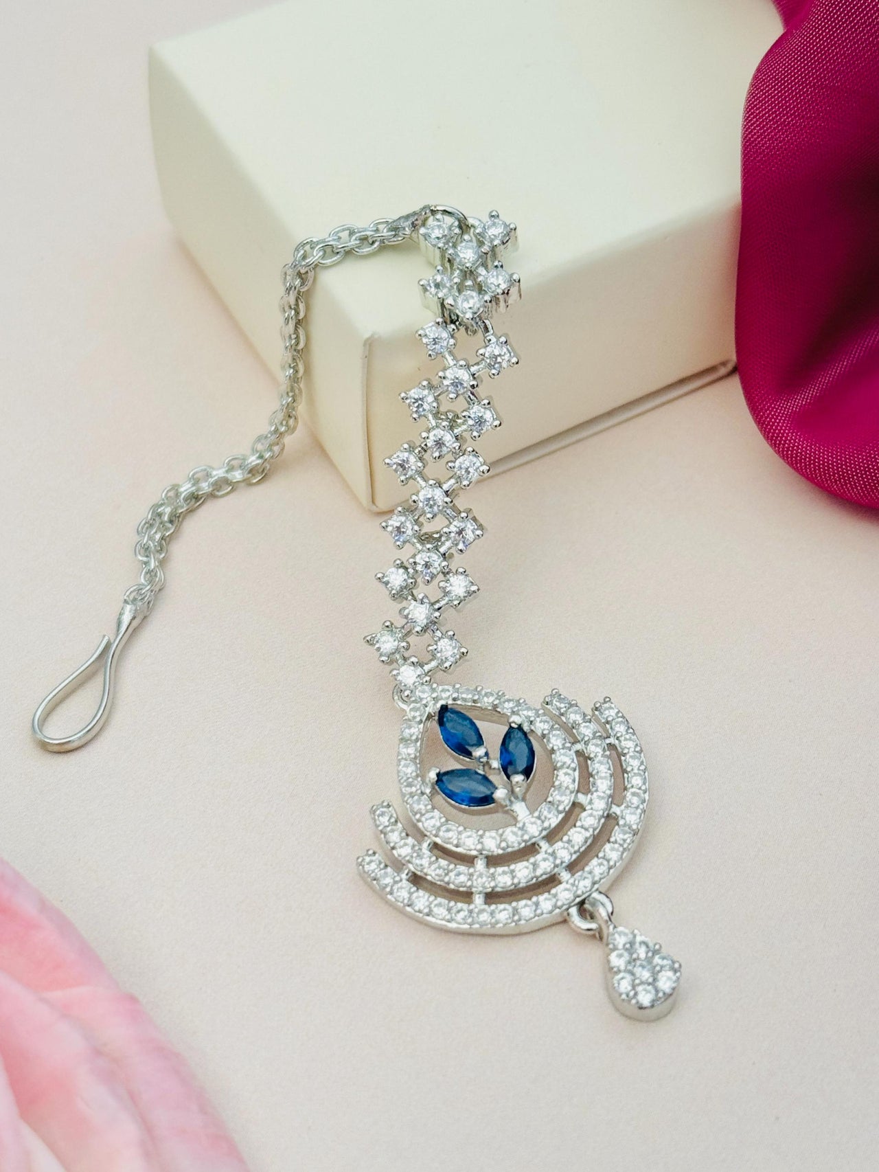 Silver Plated American Diamond Wedding Maangtikka with blue stone accents and intricate design by Abdesignsjewellery