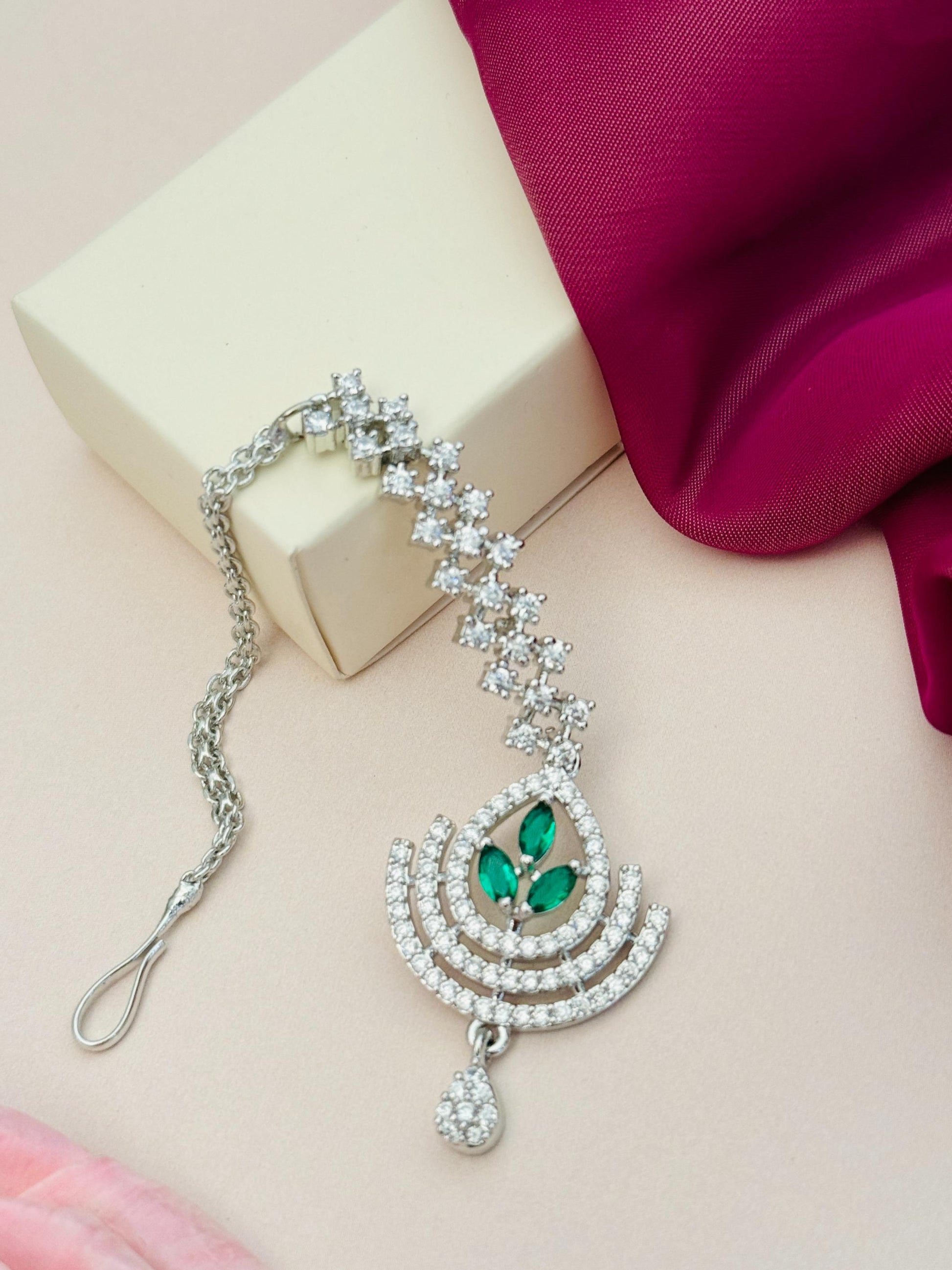 Silver Plated American Diamond Wedding Maangtikka with green stones and intricate design by Abdesignsjewellery