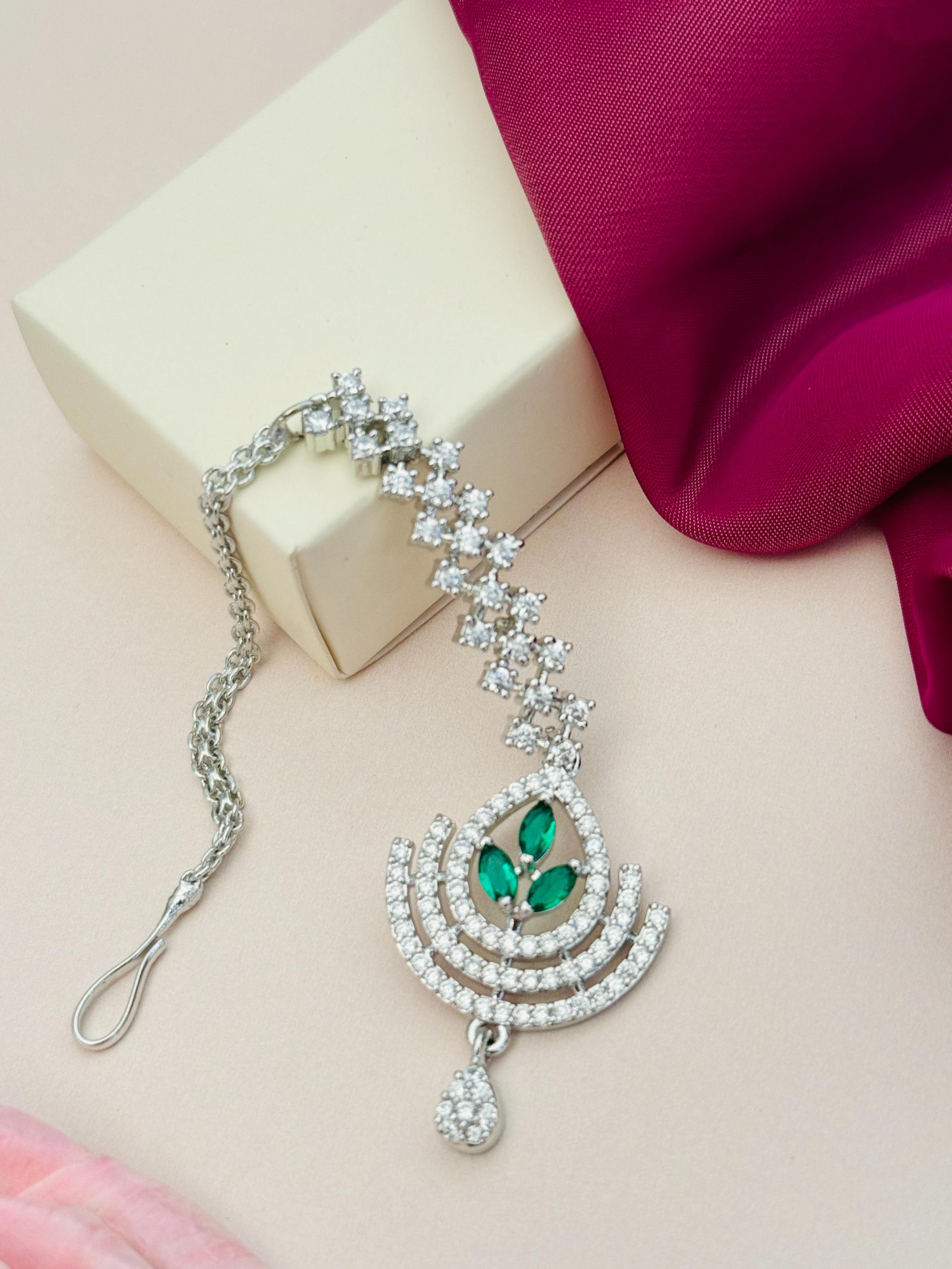 Silver Plated American Diamond Wedding Maangtikka with green stones and intricate design by Abdesignsjewellery