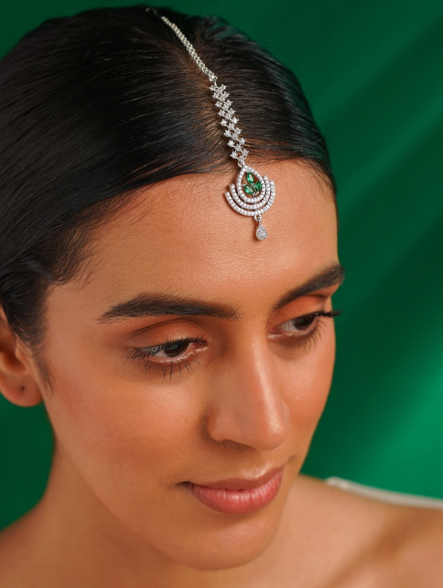 Silver Plated American Diamond Wedding Maangtikka worn on forehead with green stone and intricate design