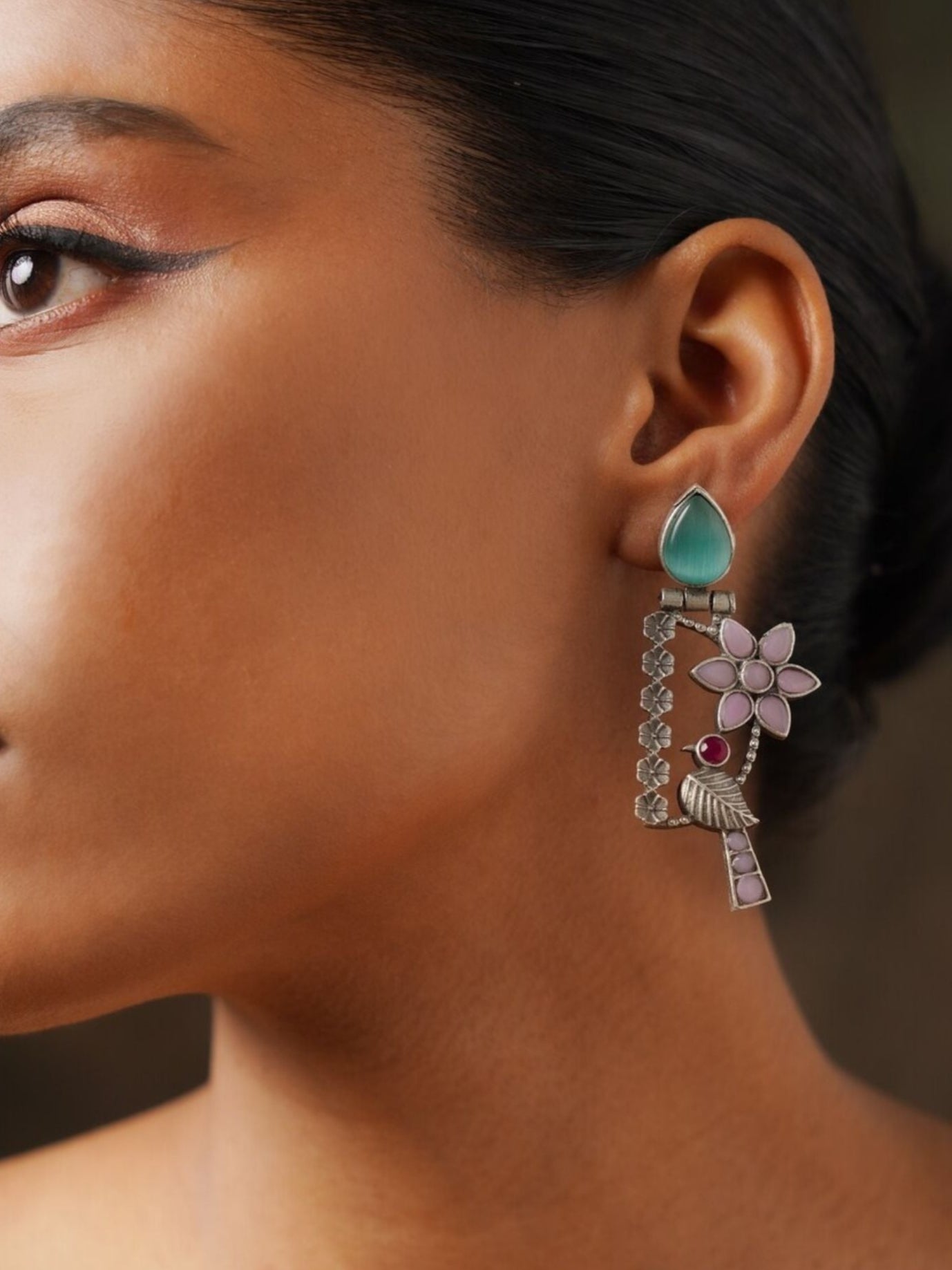 Silver Plated Bird Earrings by Abdesignsjewellery featuring floral and gemstone design worn on ear