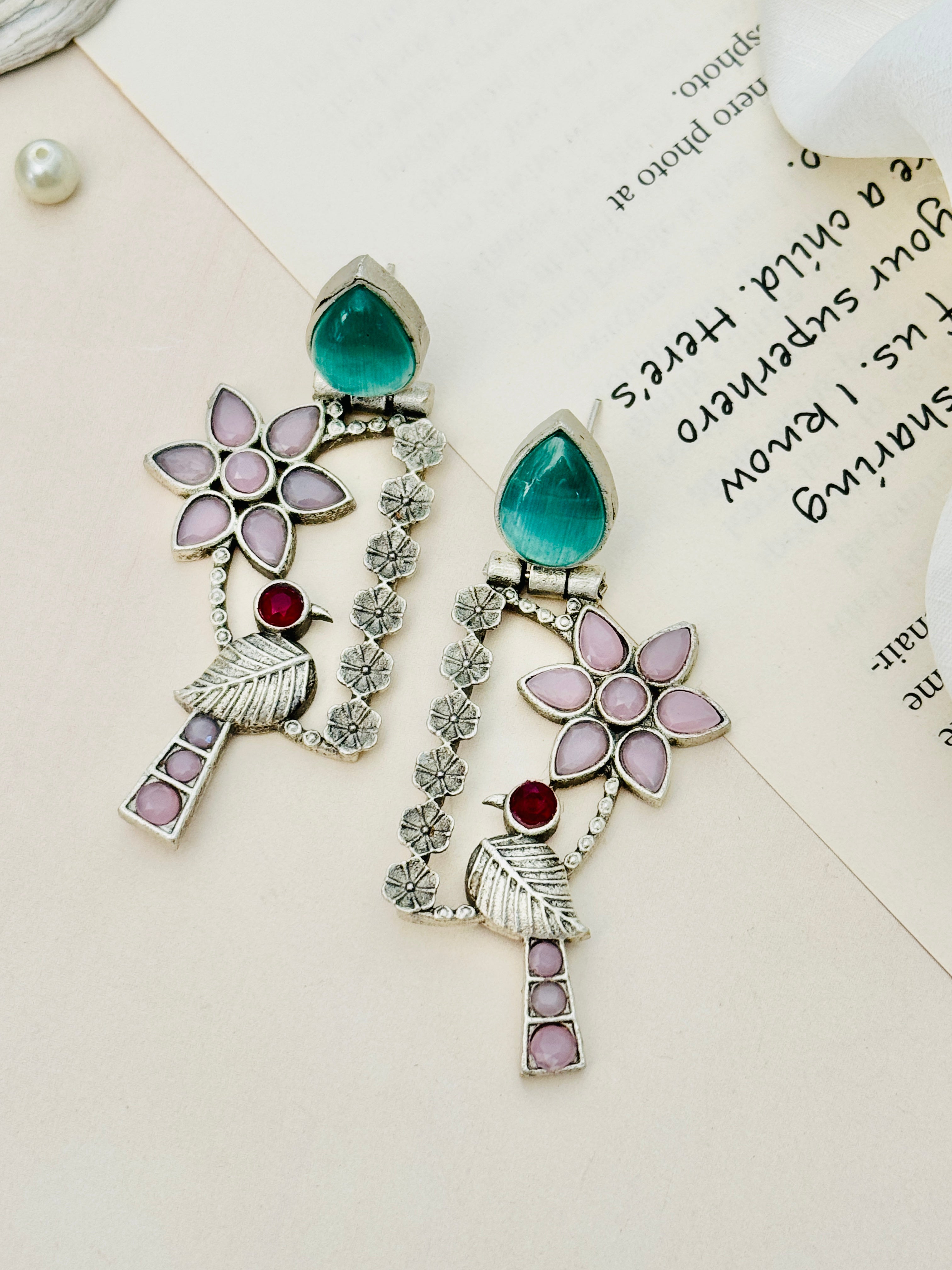 Abdesignsjewellery Silver Plated Bird Earrings with green teardrop stones and floral design