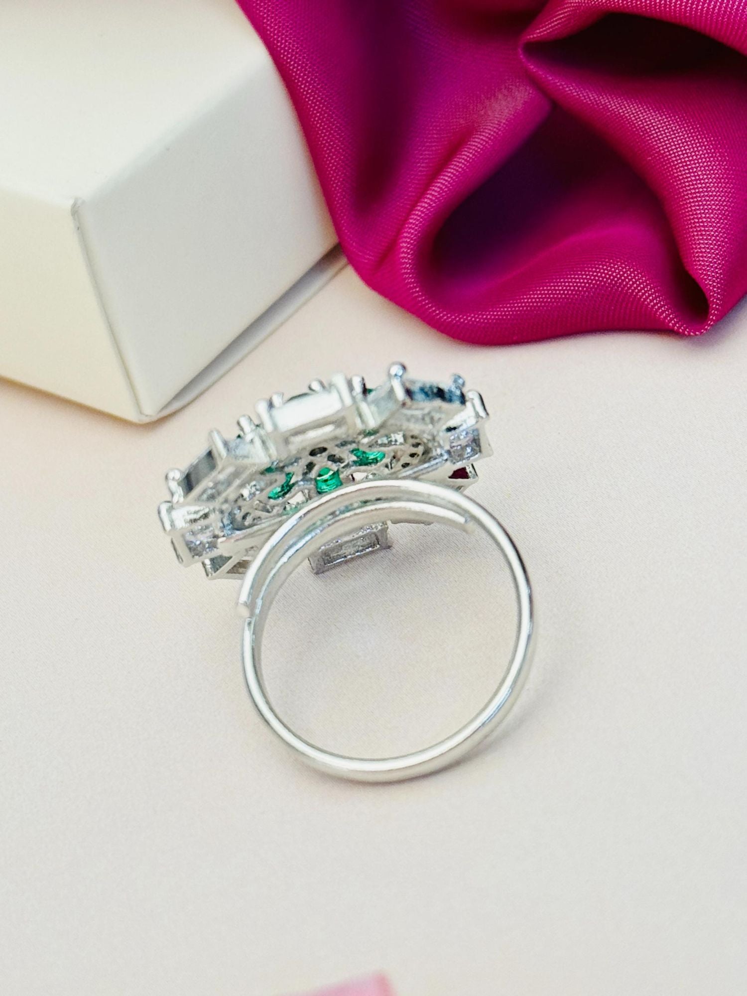 Silver Plated Elegant Design Ring from Abdesignsjewellery with intricate gemstone settings on a white surface
