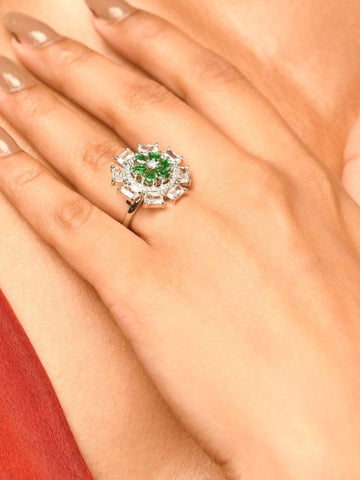 Silver Plated Elegant Design Ring featuring green and clear gemstones worn on finger