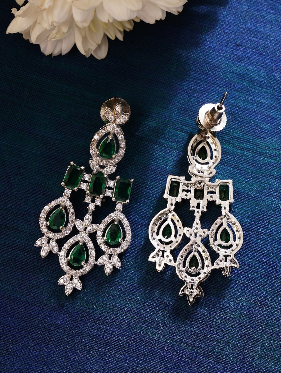 Silver Plated Emerald Stone American Diamond Necklace Set earrings with intricate design on blue background