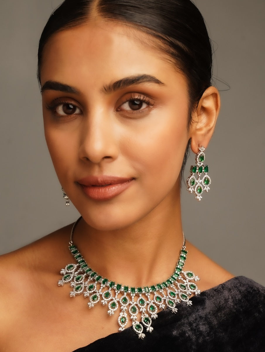 Silver Plated Emerald Stone American Diamond Necklace Set worn by woman with matching earrings
