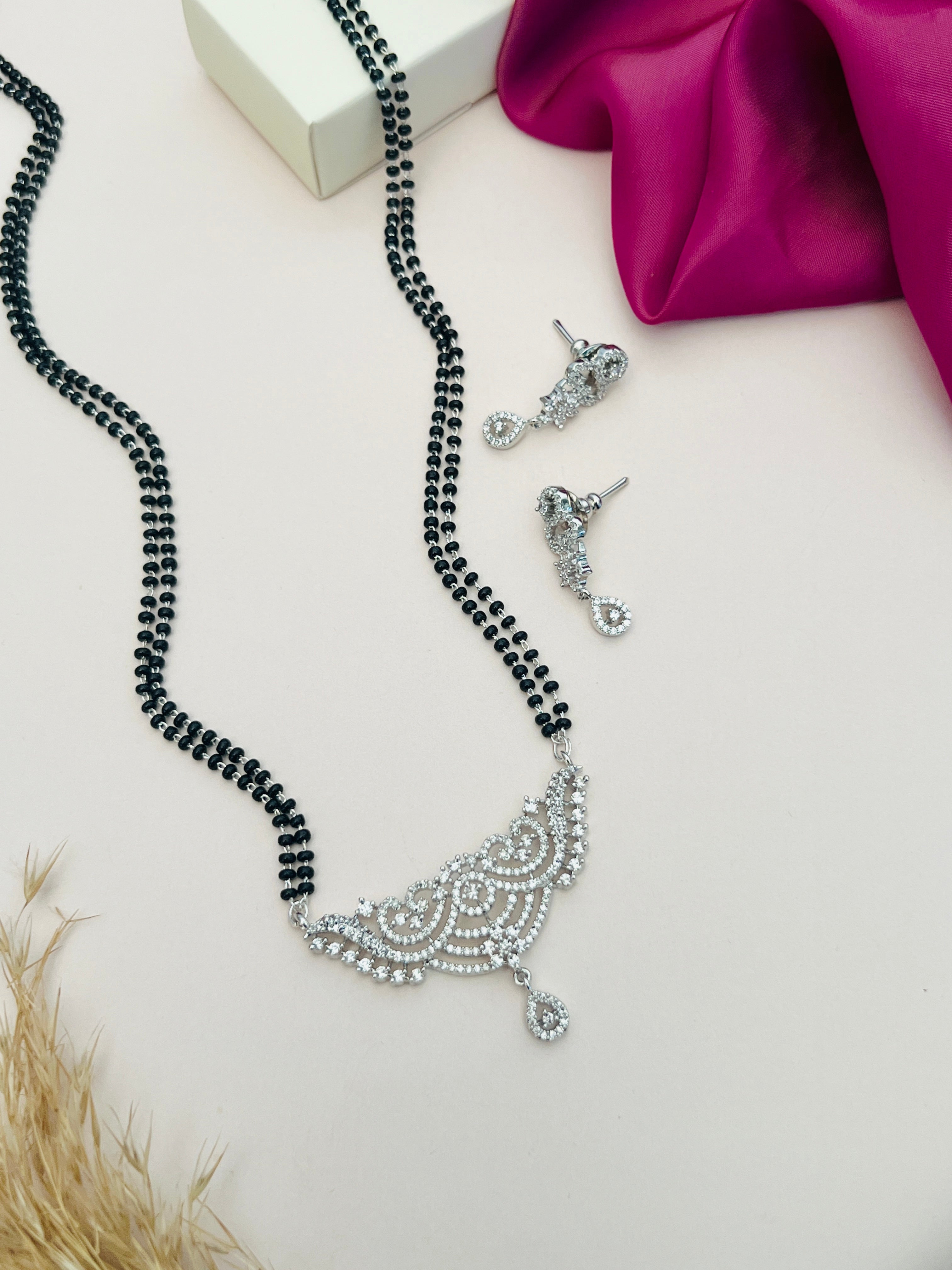Silver Plated Long Peacock Mangalsutra Set with intricate design and matching earrings by Abdesignsjewellery