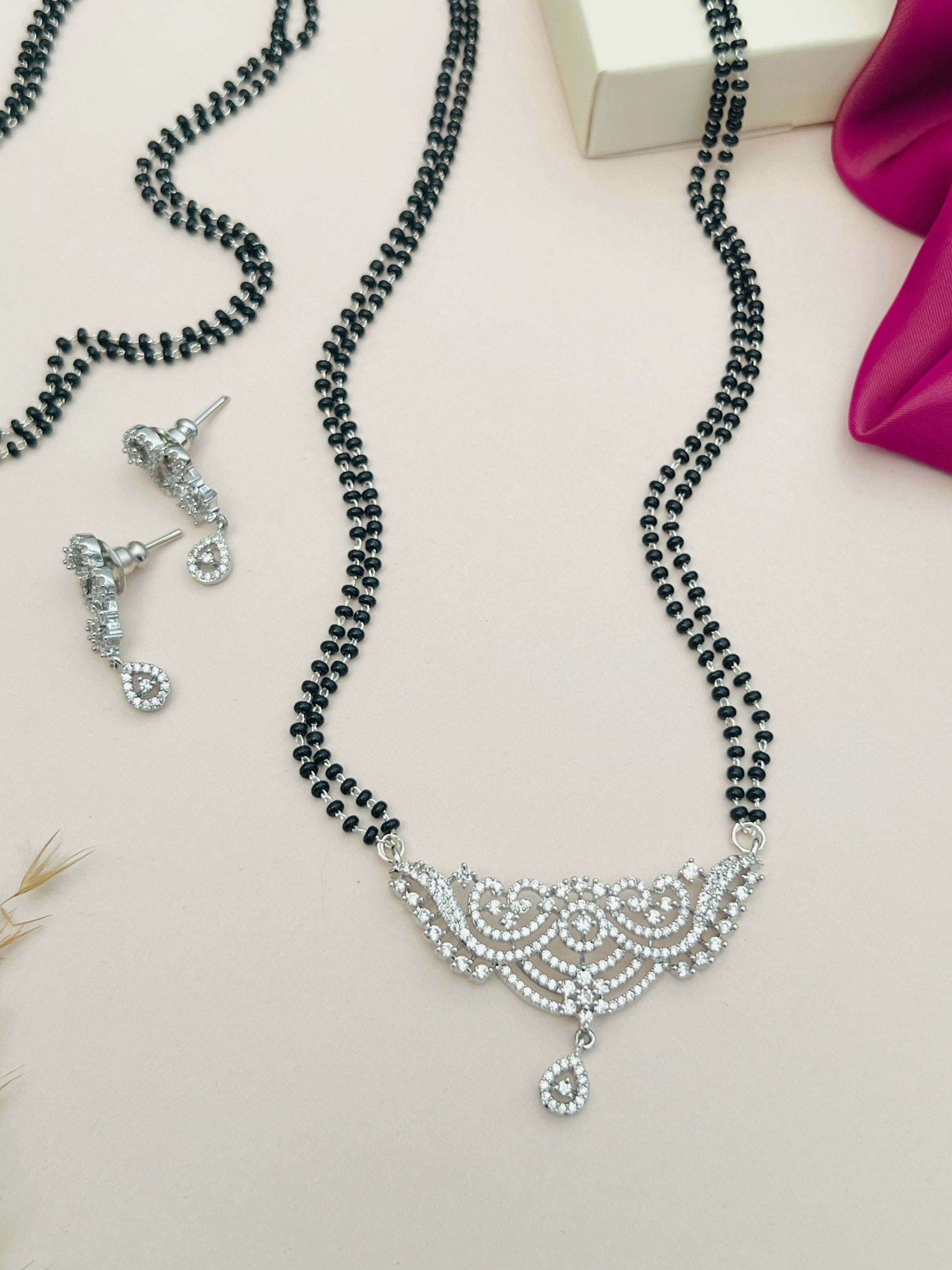 Silver Plated Long Peacock Mangalsutra Set with intricate peacock design and matching earrings by Abdesignsjewellery