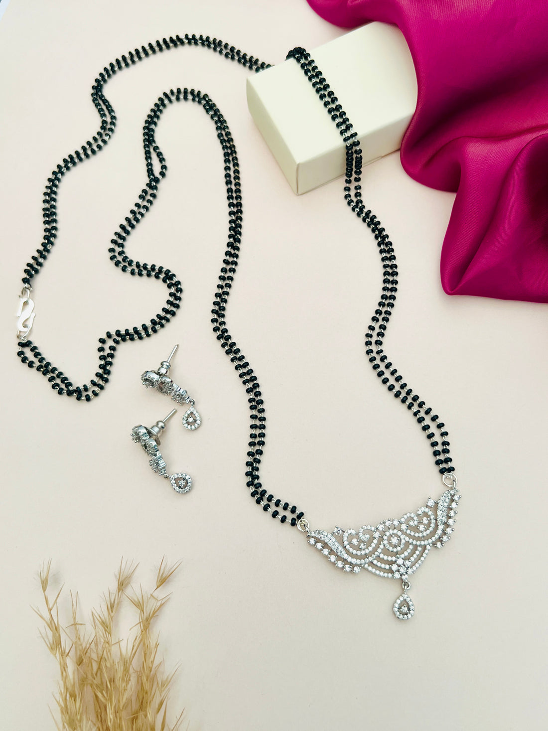 Silver Plated Long Peacock Mangalsutra Set with black beads and intricate silver peacock pendant paired with matching earrings