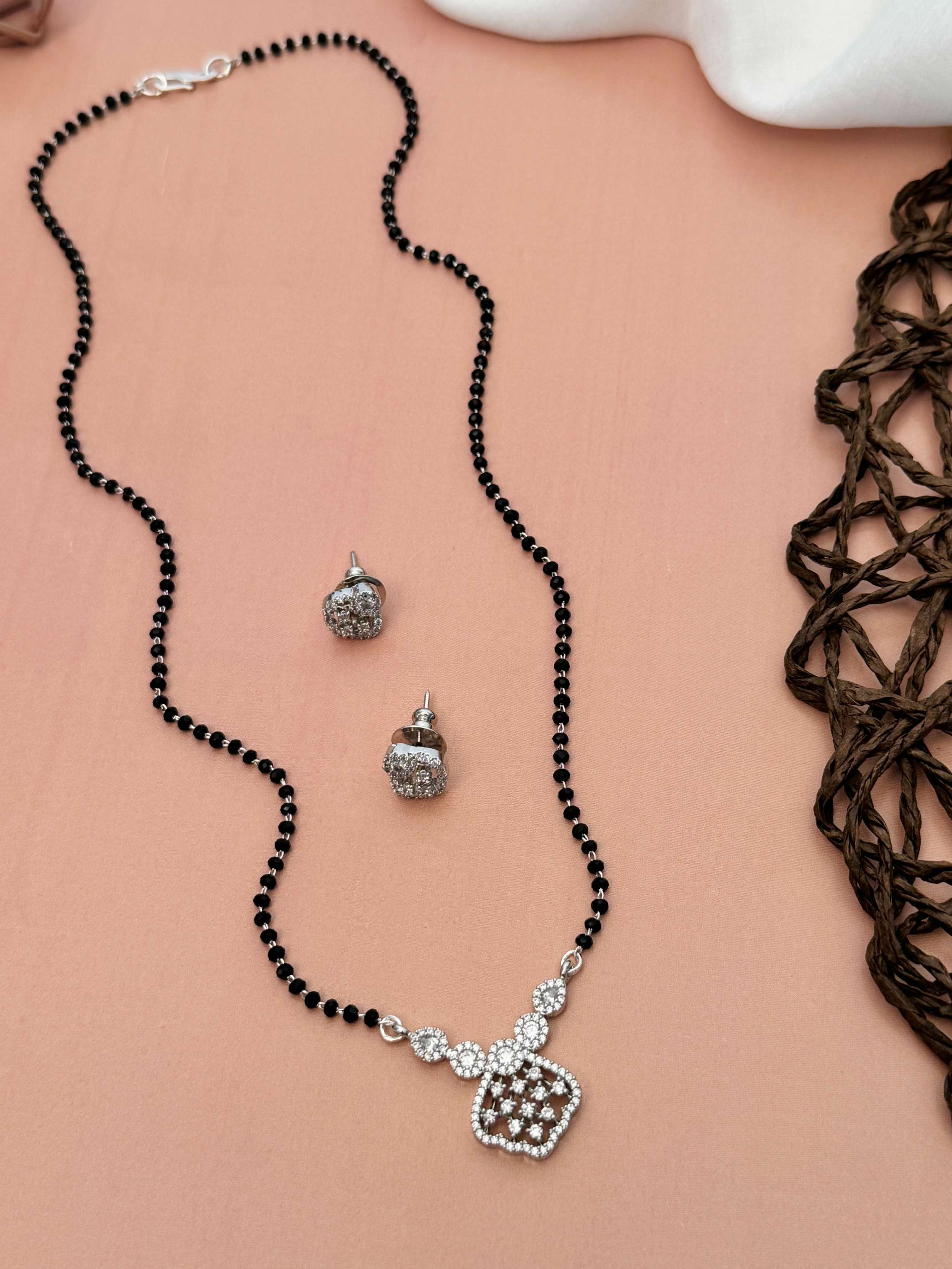 Solitaire American Diamond Mangalsutra Set with black beads and matching stud earrings by Abdesignsjewellery