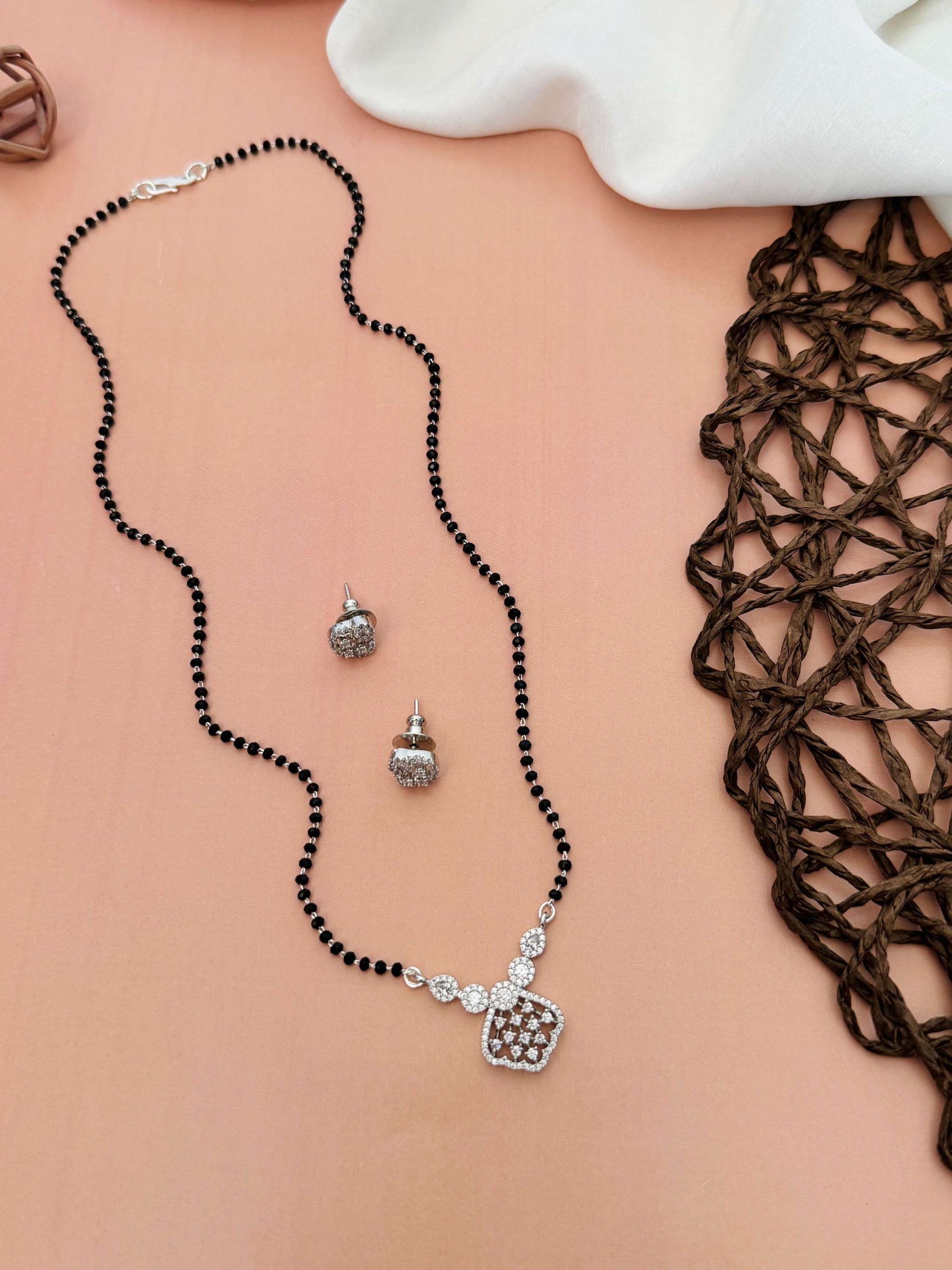 Solitaire American Diamond Mangalsutra Set with black beads and silver pendant by Abdesignsjewellery