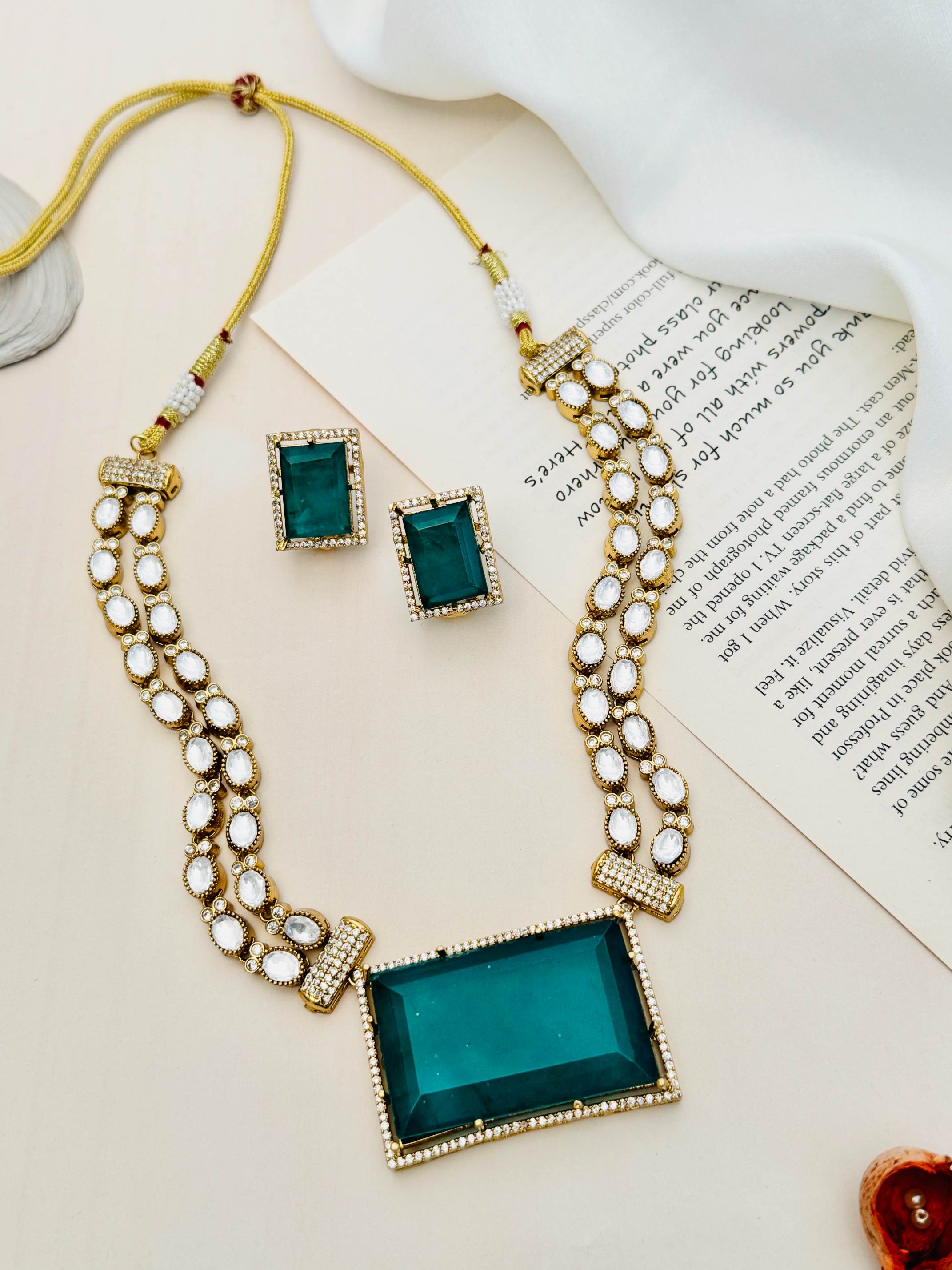 Sophisticated Gold Plated Polki Bridal Necklace with large green centerpiece and matching earrings by Abdesignsjewellery