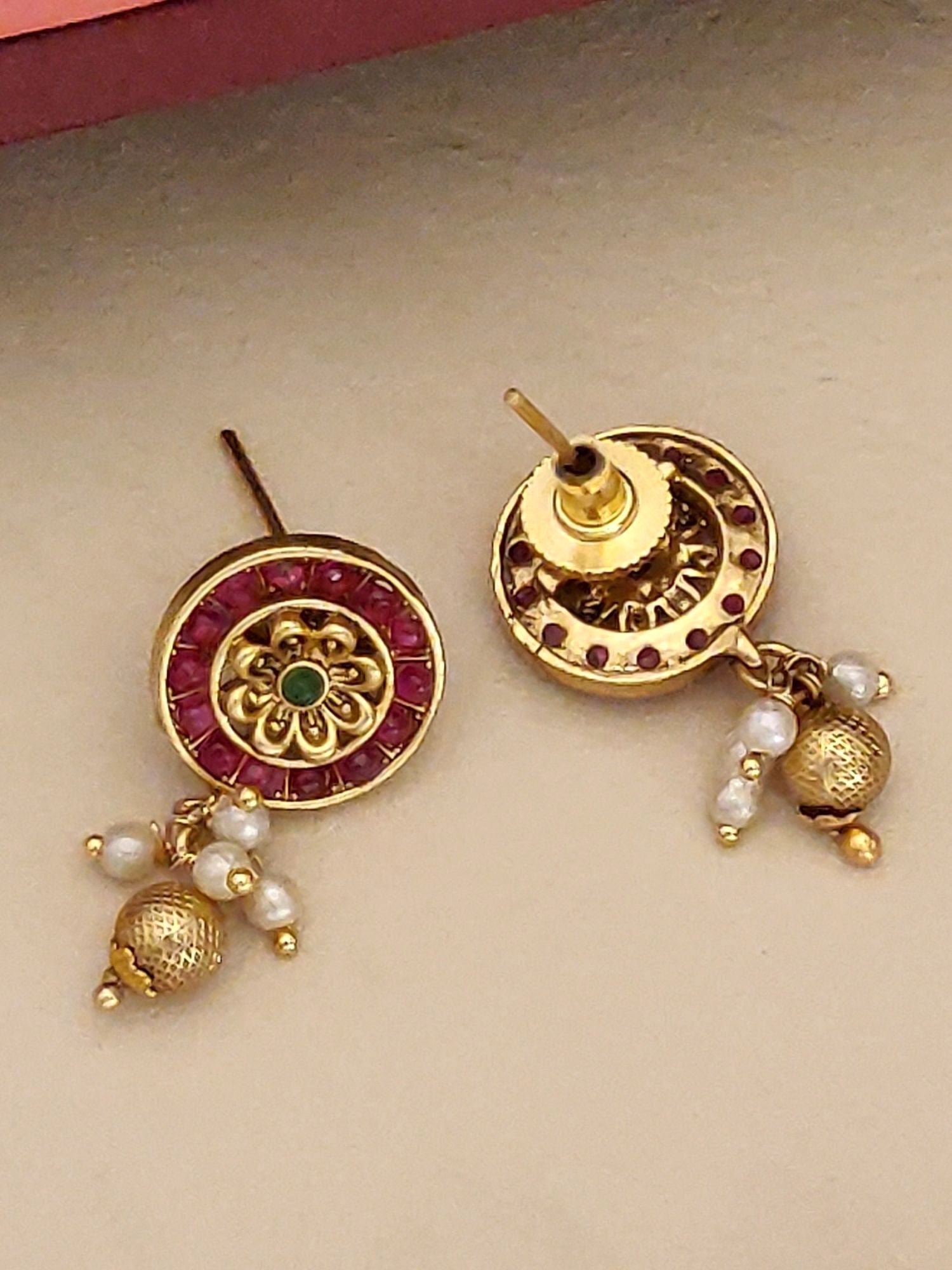 South Indian Antique Jewelry Necklace Set featuring traditional gold-tone earrings with red stones and pearl dangles