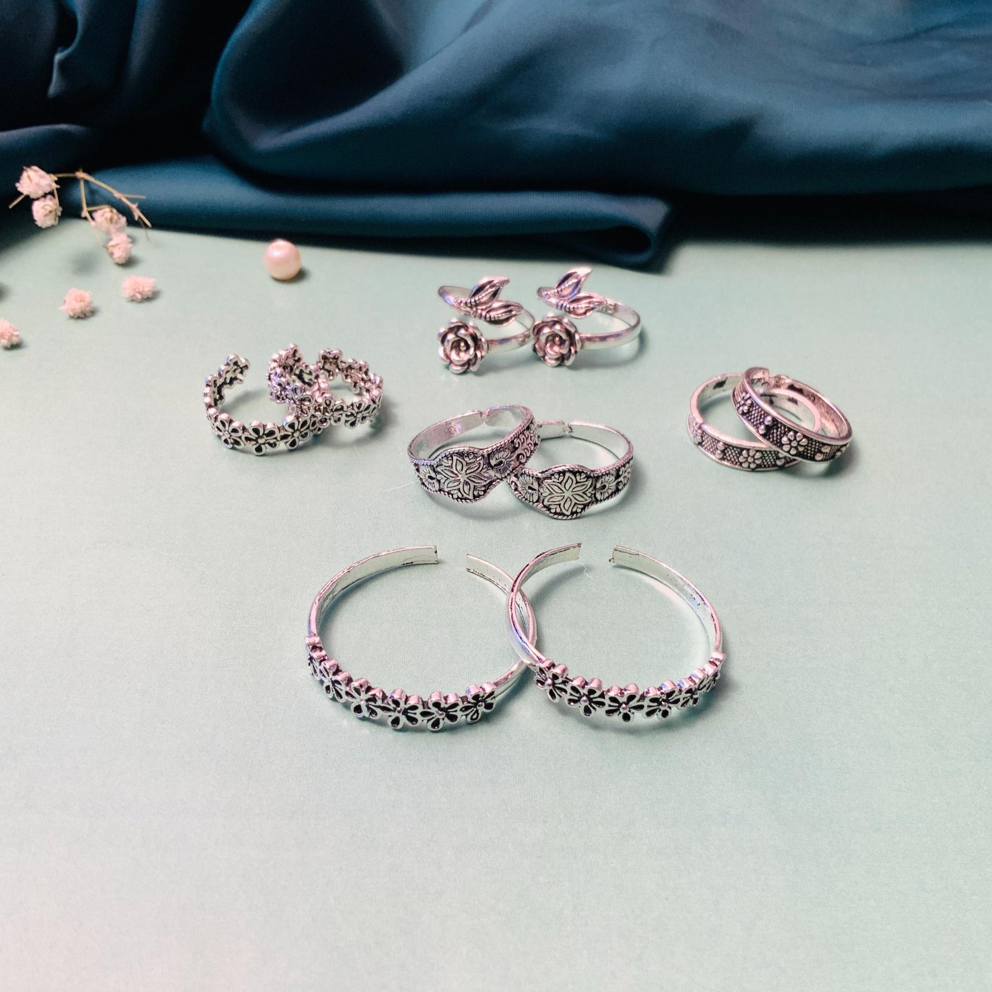 Collection of stylish toe rings featuring floral designs and charming motifs by Abdesignsjewellery