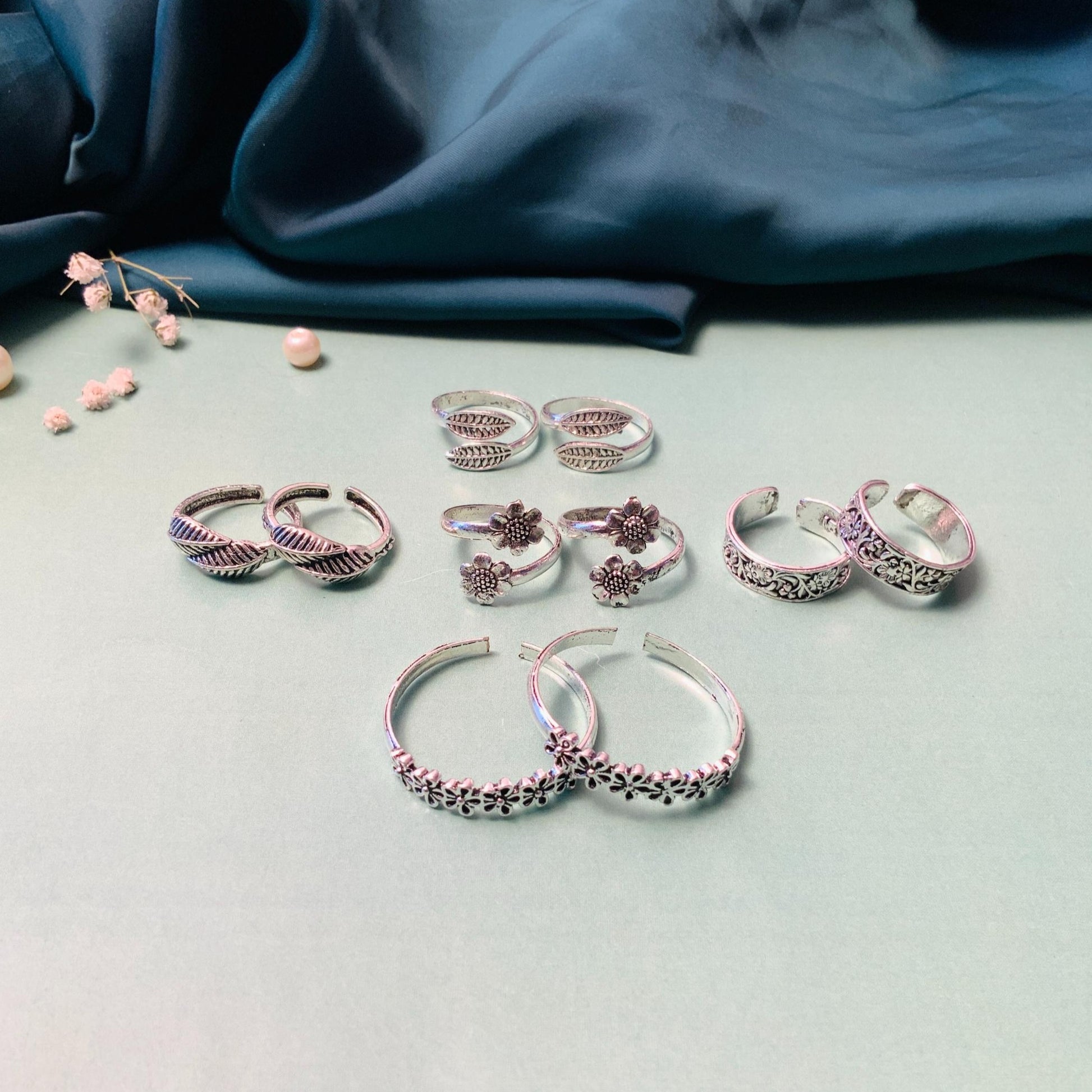 Variety of silver toe rings from Abdesignsjewellery featuring floral and leaf designs