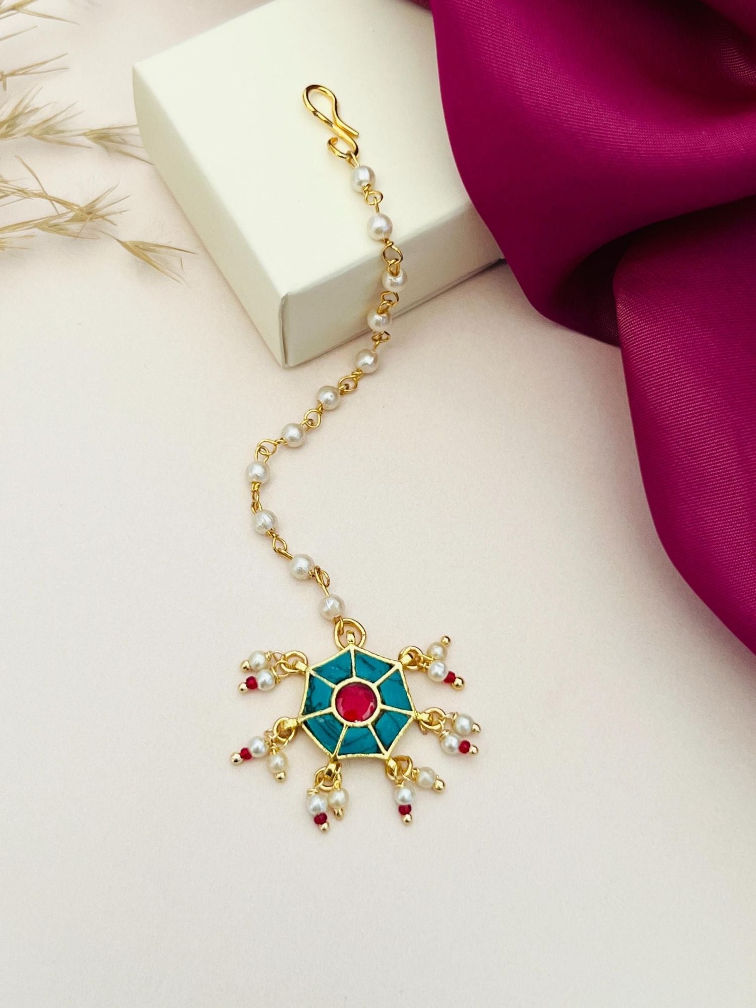 Traditional gold maangtikka with blue and red enamel design and pearl accents by Abdesignsjewellery