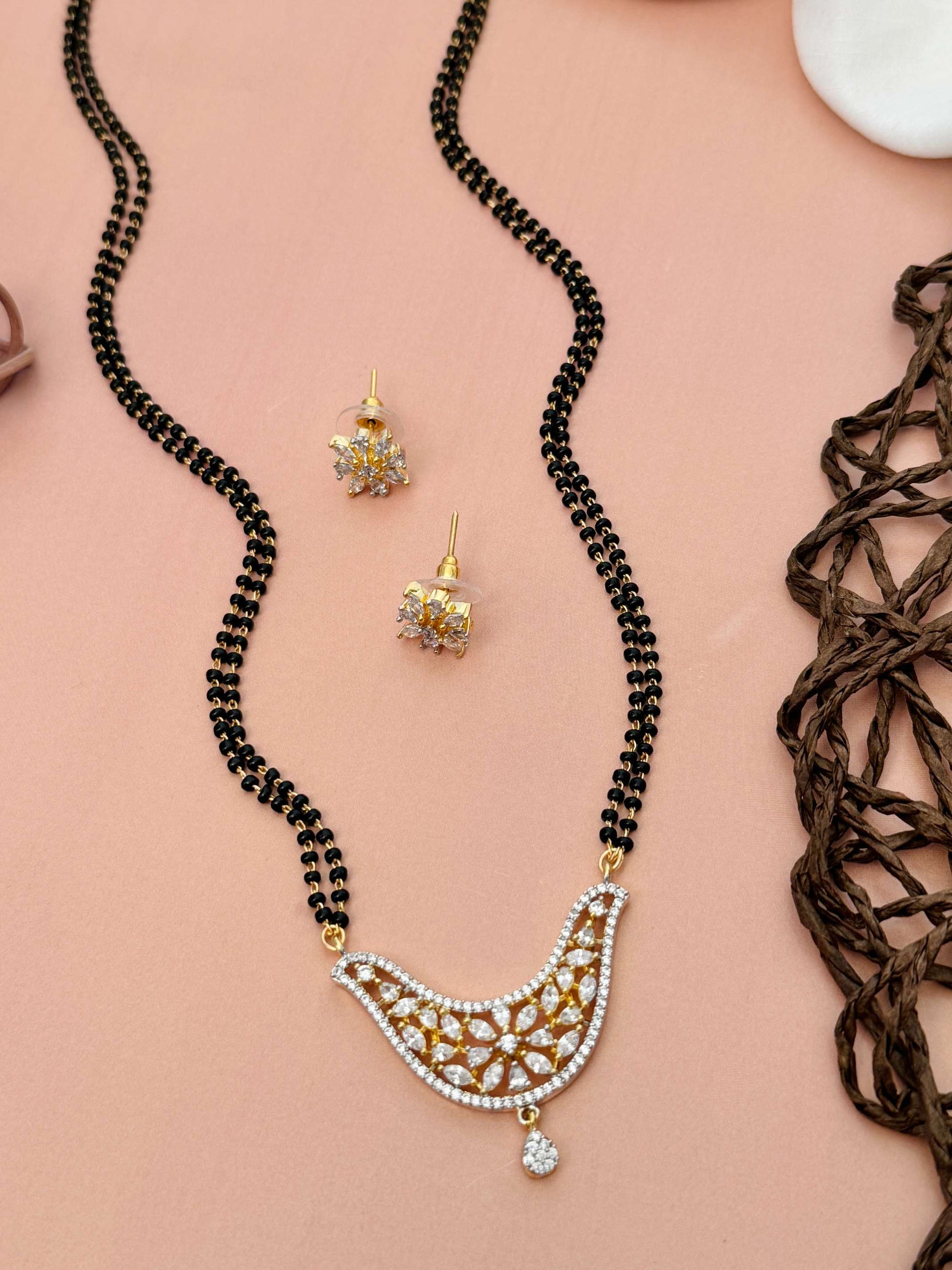 Unique American Diamond Mangalsutra Set with gold pendant and matching earrings by Abdesignsjewellery