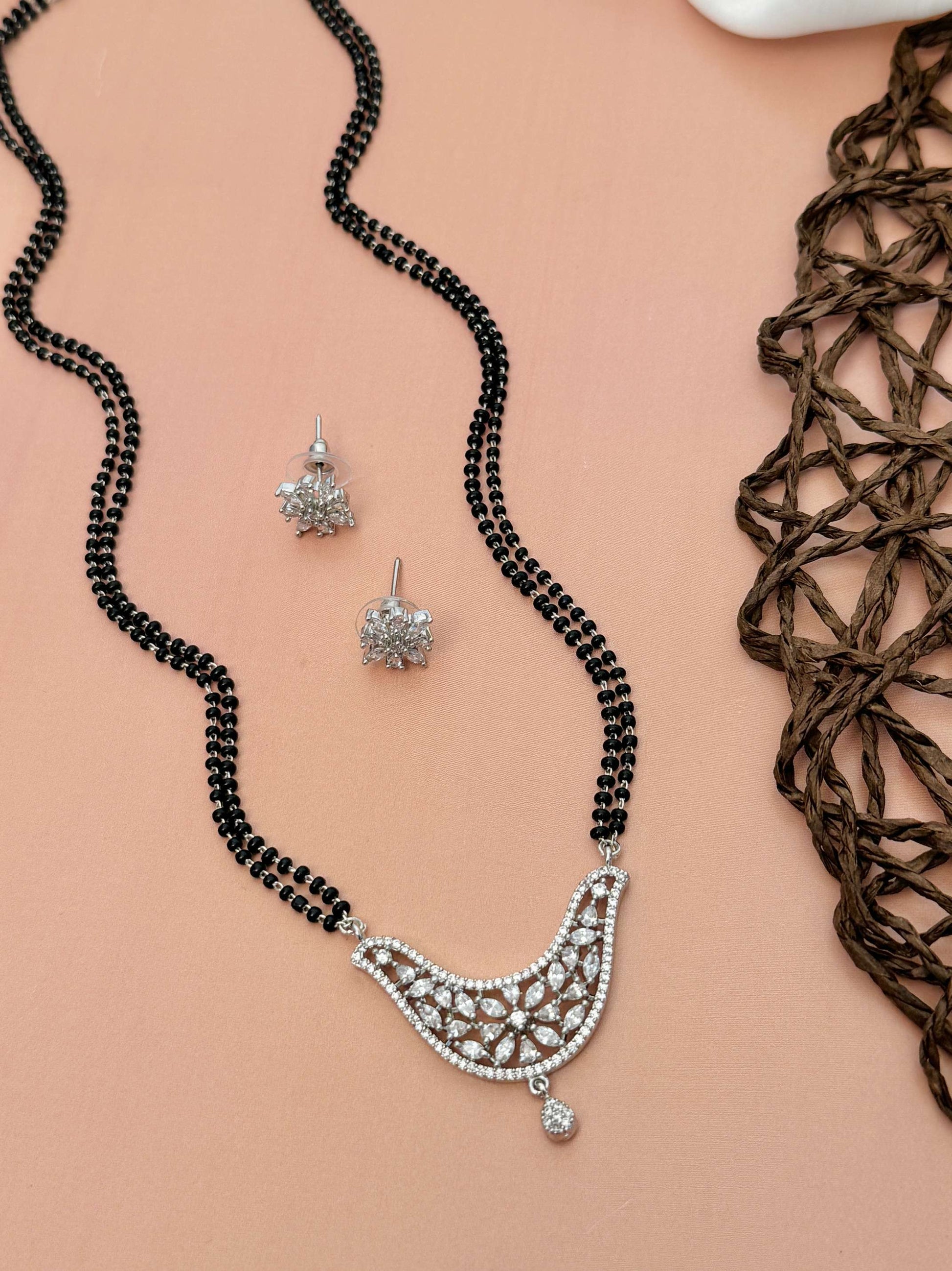 Unique American Diamond Mangalsutra Set by Abdesignsjewellery featuring black beads and intricate diamond pendant with matching earrings
