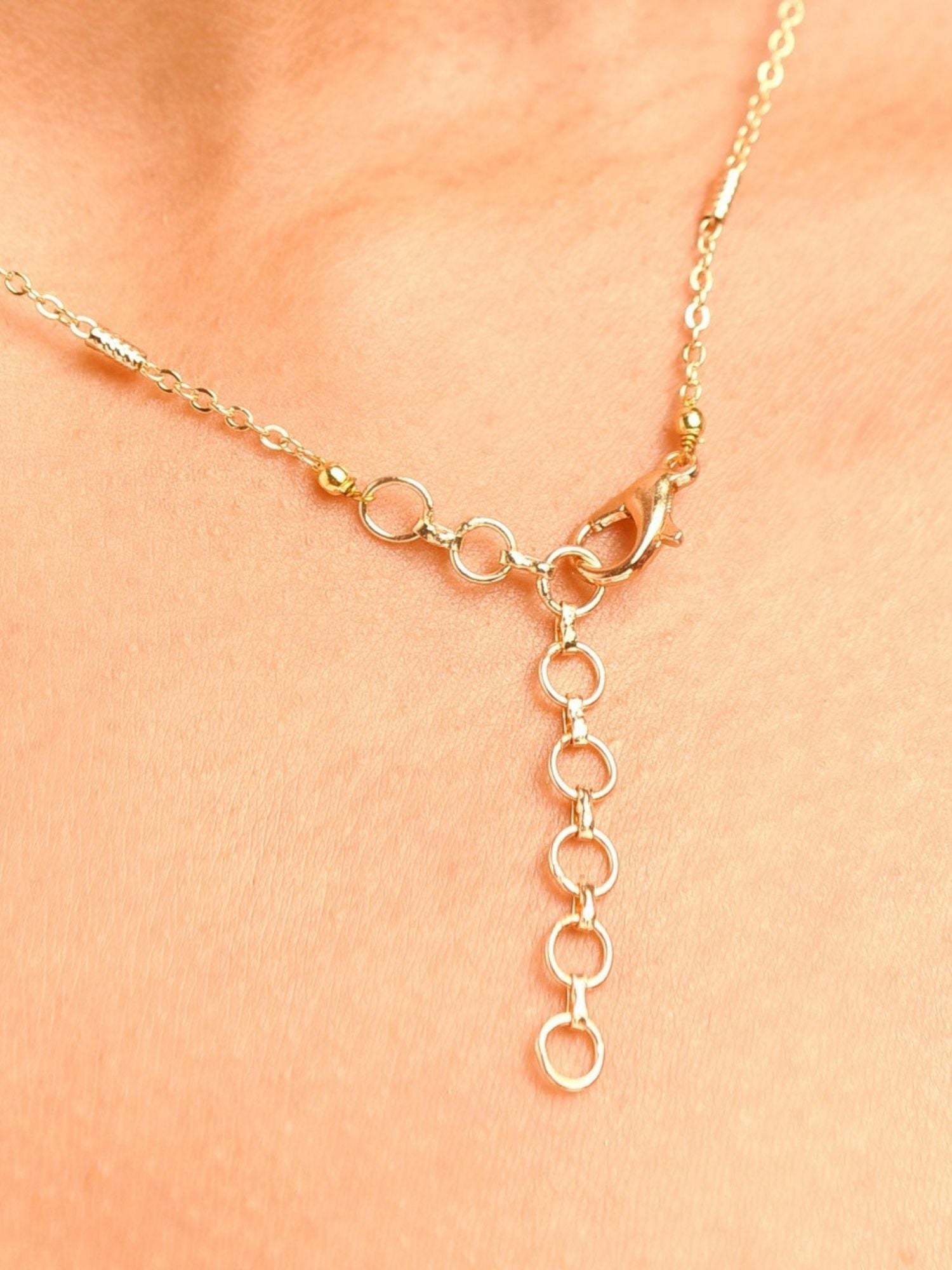 Unique Gold Plated Uncut Polki Pendant Chain clasp and adjustable links close-up on skin
