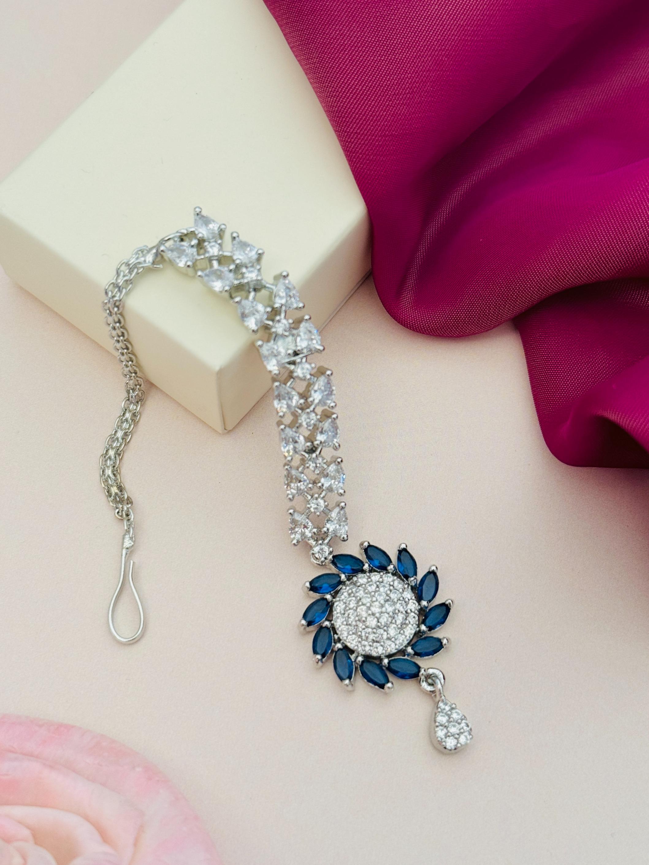 Unique Silver Plated American Diamond Maangtikka with blue stones and intricate design by Abdesignsjewellery