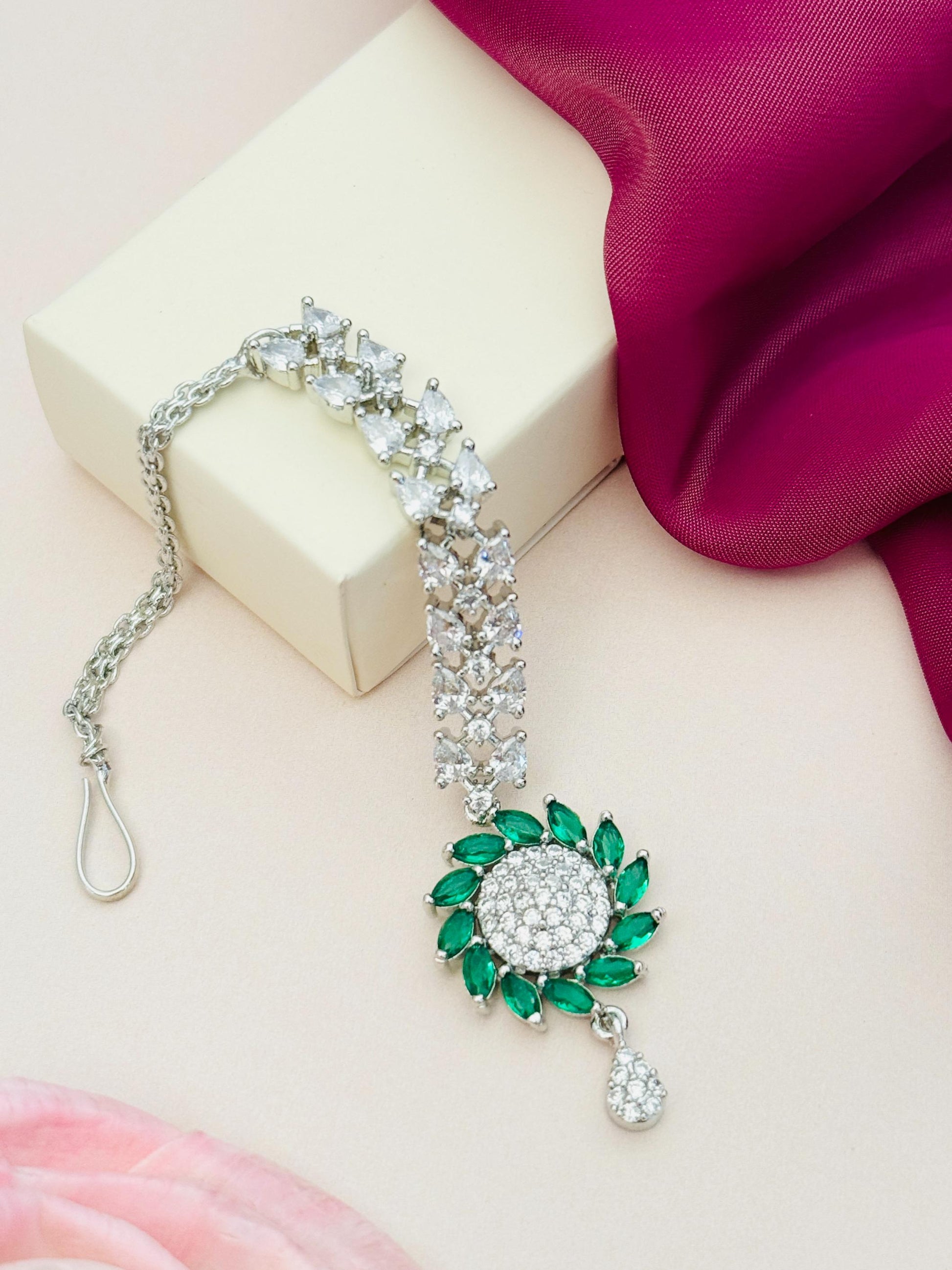 Unique Silver Plated American Diamond Maangtikka with green stones and white diamond embellishments