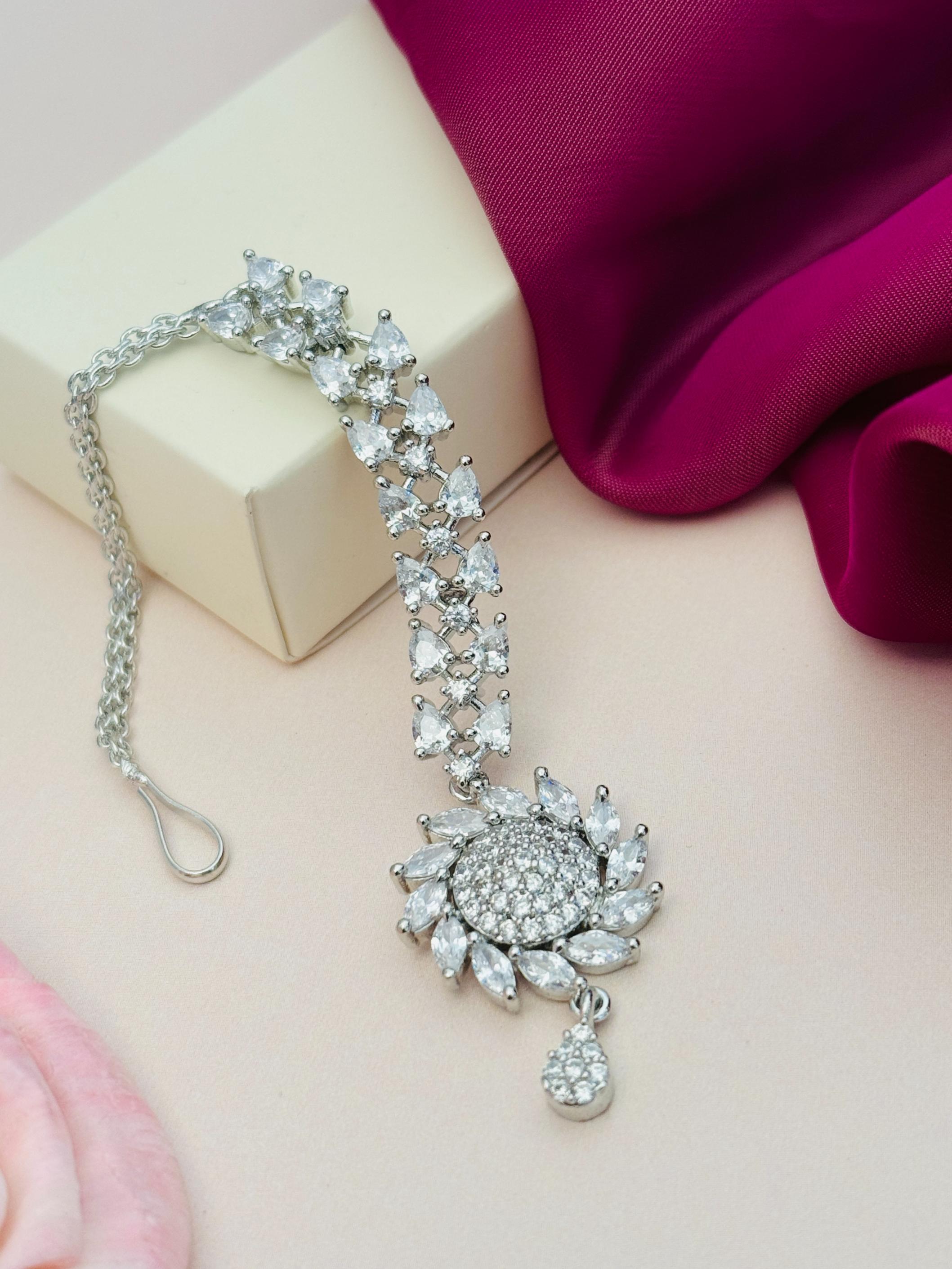 Unique Silver Plated American Diamond Maangtikka with floral design and intricate stone detailing