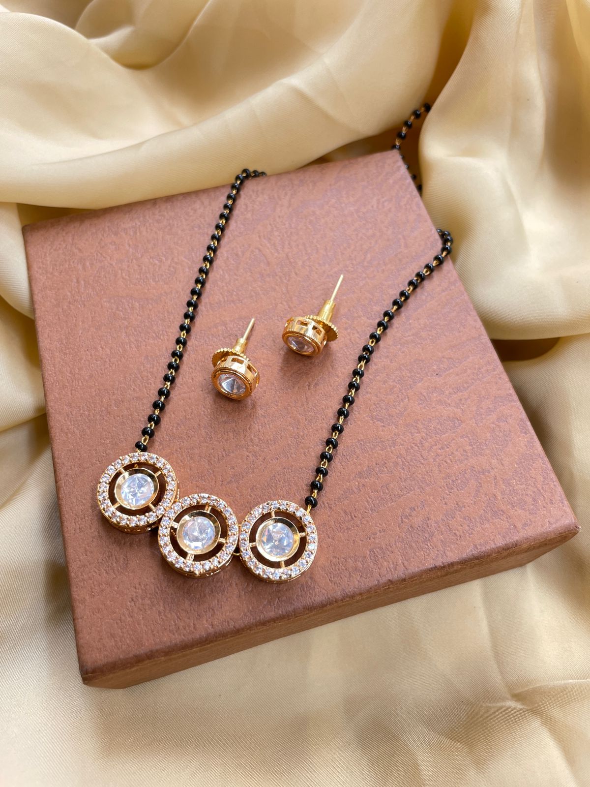 Astonishing Gold Round Stone Mangalsutra & Earrings - Abdesignsjewellery