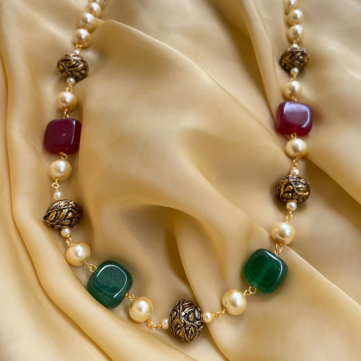 Elegant Mala necklace by Abdesignsjewellery featuring jade and pearl beads with ornate metal accents