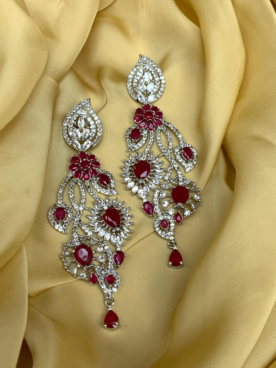 Abdesignsjewellery silver American diamond earrings long chandelier with red teardrop stones and floral motifs